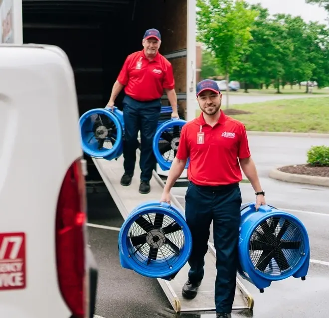 Rainbow Restoration service professional arrives at a home to provide smoke and fire damage restoration services.