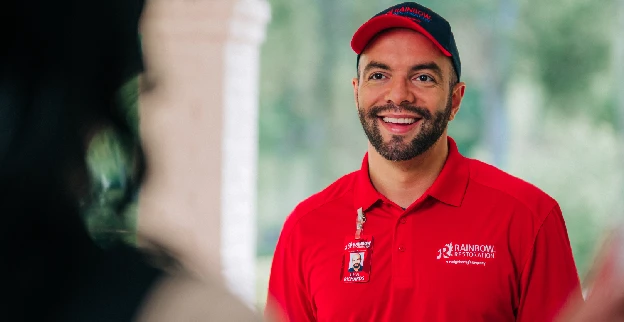 Smiling Rainbow Restoration technician.