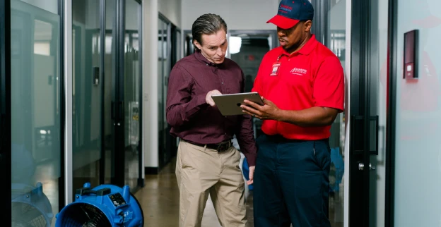 A Rainbow Restoration professional providing commercial water damage restoration services.