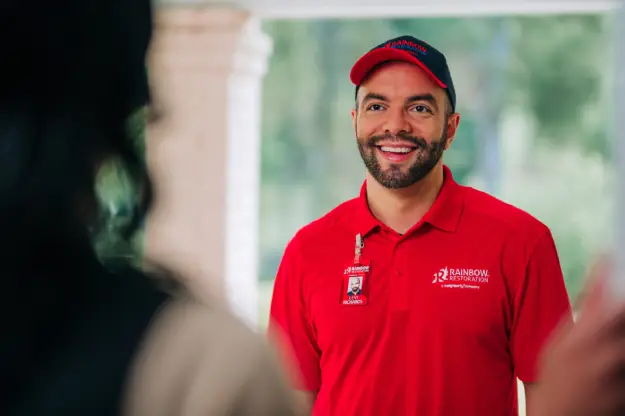 RBW tech smiling at the door.
