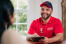 RBW tech smiling holding Ipad.
